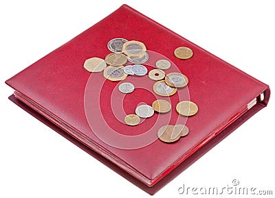 Different coins on red numismatics album Stock Photo