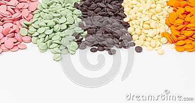 Different color chocolate on a white background. Strawberry, white, lime, black Stock Photo