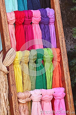 Different colored scarves on the street Stock Photo