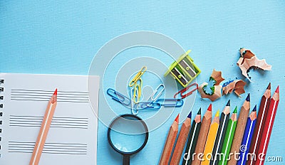 Different colorful pencils and scissors or office supplies on a white background. Education or business concept. Empty place for t Stock Photo