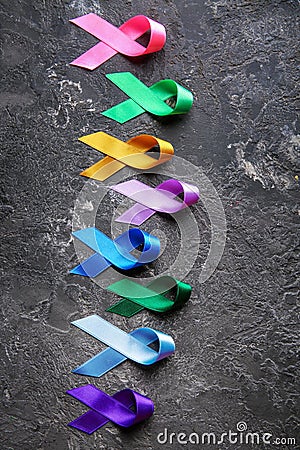 Different colorful ribbons on grunge background. Cancer concept Stock Photo