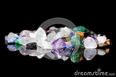 Different colorful rough gems, minerals and crystals in front of Stock Photo