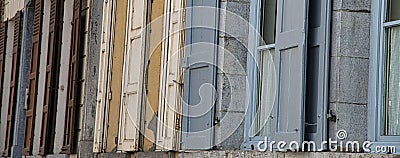 Different coloured open Sutters on windows Stock Photo