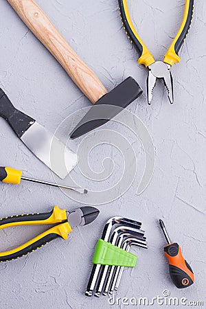 Different construction tools on gray background. Stock Photo