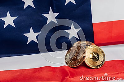 Different cryptocurrency coins on an United States flag. Editorial Stock Photo