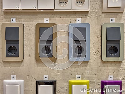 Different designs of electric sockets. Modern house improvement elements. Exhibition stand with electric socket examples Stock Photo