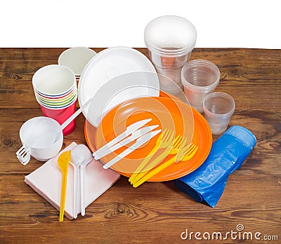 Different disposable cutlery, paper napkins and garbage bags Stock Photo