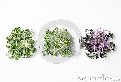 Different fresh microgreens isolated on white, top view Stock Photo