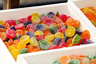 Different gelatin sweet fruit candy candies sugar. Assorted colorful jelly sweets. Colored confectionery for kids. Stock Photo