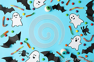 Different halloween accessories on blue background, top view Stock Photo