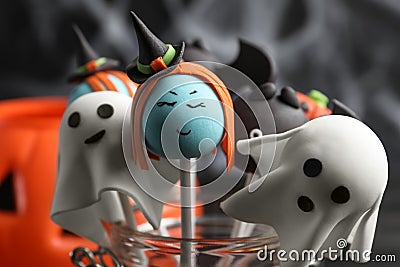 Different Halloween themed cake pops on dark background, closeup Stock Photo