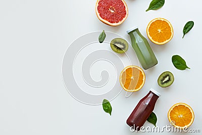 Different juices and fruits on white background. Healthy and fresh concept. Copy space. Stock Photo