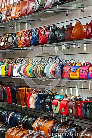 Different kind of leather purse bags colorful vibrant colors selling in the Italian market shop Editorial Stock Photo