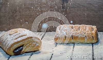 Different kinds of bread rolls on black board from above Stock Photo