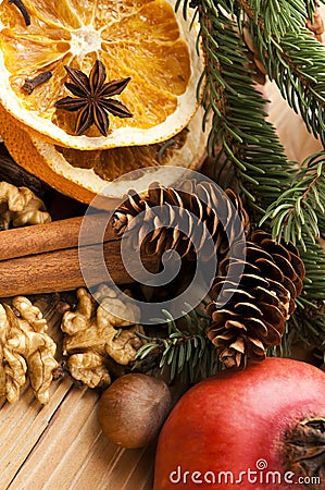 Different kinds of spices, nuts and dried oranges Stock Photo