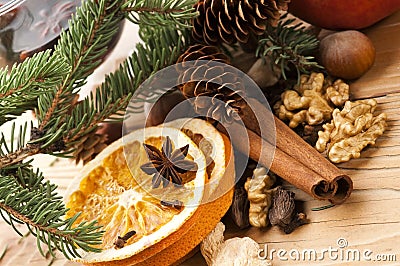 Different kinds of spices, nuts and dried oranges Stock Photo