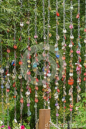 Different locks on chains. A symbol of fidelity and a long marriage. Wedding traditions. Stock Photo