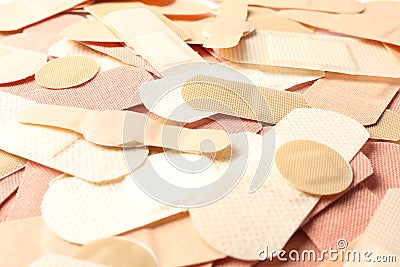 Different medical sticking plasters as background. First aid item Stock Photo