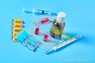 Different medicaments on blue table Stock Photo