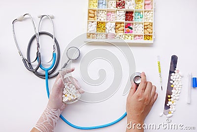 Different medication with stethoscope isolated Stock Photo