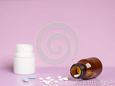 Different medications. Various pill bottles. One-color backdrop. Stock Photo