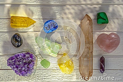 Different minerals and crystals on the white wooden background Stock Photo