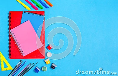 Different notebooks for notes with stationery on a blue background Stock Photo