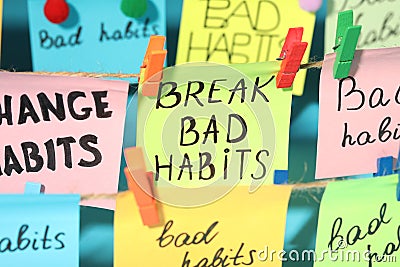 Different paper notes hanging on ropes, closeup. Break Bad Habits Stock Photo