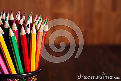 Different pencils on the brown wooden table background Stock Photo