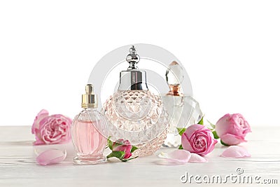 Different perfume bottles and flowers Stock Photo