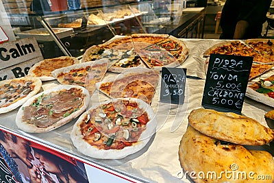 Different see pizzas on display in an italian store or bar Stock Photo