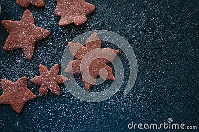 Different shapes of chocolate gingerbread cookies sprinkled with Stock Photo