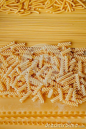 Different shapes and types of raw pasta: Curly Macaroni ,Vermicelli, Spaghetti, Spaghettini,Fusilli, Girandole, Maccheroni, Stock Photo