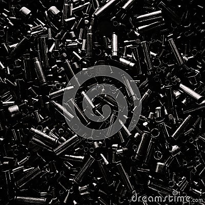 Different size bullet shells on the black ground. War concept. production of ammunition at the factory. brass bullet shell, Stock Photo