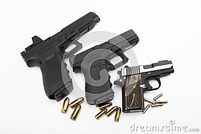 Different size of Semi automatic hand gun and bullets on white background , Comparison of guns Stock Photo