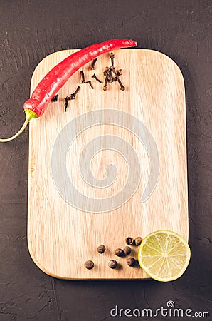 Different spices and empty cutting board/Different spices and em Stock Photo
