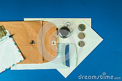 Different stuff to send a post mail like papers, envelope, pens and other objects. Copy space Stock Photo