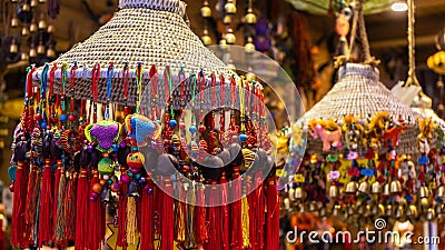 Colorful knotting decorative Chinese charms are hung and sold inside the shop at the street of Fenghuang Province in China Stock Photo