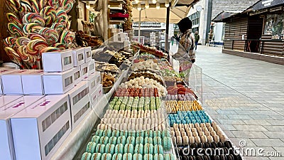 Different sweets on the counter are laid out all the colors of the rainbow as much as the saliva flows from jelly Editorial Stock Photo