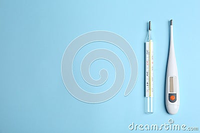 Different thermometers on blue background, flat lay. Space for text Stock Photo