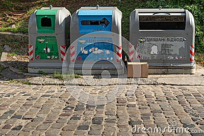 Different trash cans for differentiate sorted garbage to recycling Editorial Stock Photo