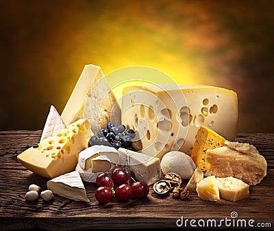 Different types of cheese over old wood. Stock Photo