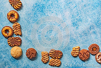 Different types of bisquits as a frame on vintage background Stock Photo