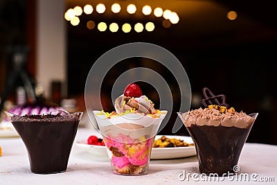 different types of cup cake with glass cups Stock Photo