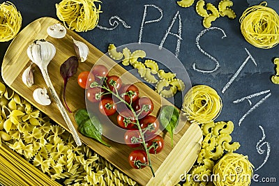 Different types of dried Italian pasta on a blue background. Top view Stock Photo