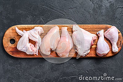 Different types of raw chicken meat, poultry. Black background. Top view Stock Photo