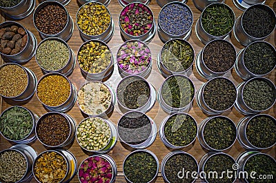 Different types of tea in round containers Stock Photo