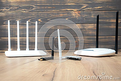 Different types of Wi-Fi routers, modern and old technology. Wireless ethernet connection signal. USB Wifi Receiver Wireless Stock Photo