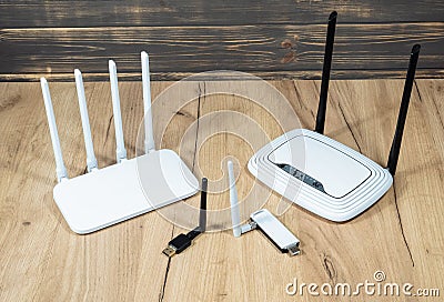 Different types of Wi-Fi routers, modern and old technology. Wireless ethernet connection signal. USB Wifi Receiver Wireless Stock Photo