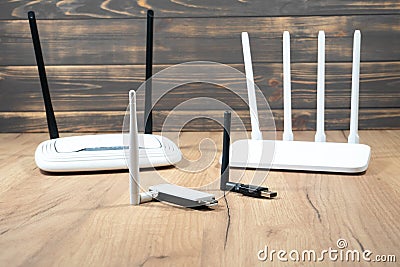 Different types of Wi-Fi routers, modern and old technology. Wireless ethernet connection signal. USB Wifi Receiver Wireless Stock Photo